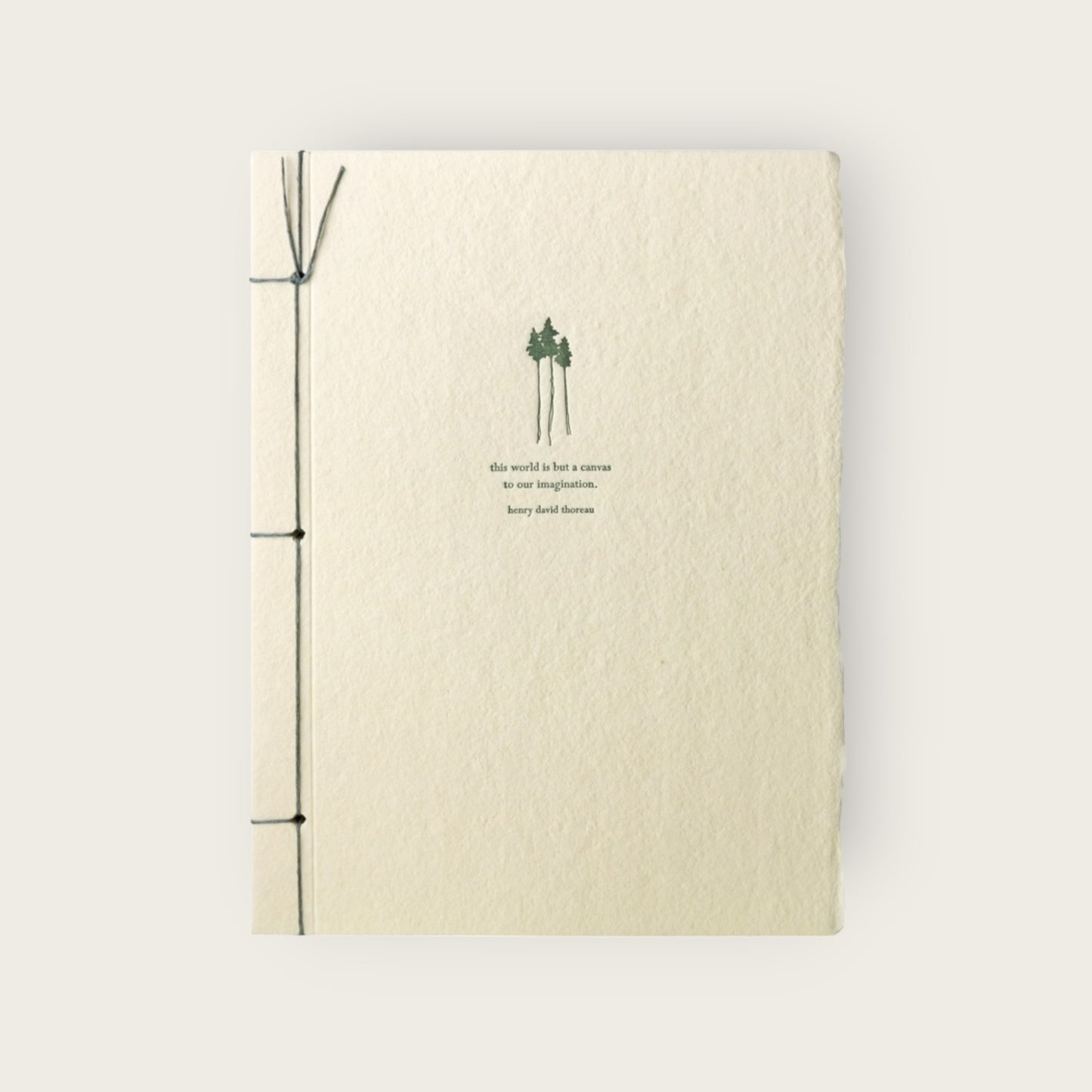 Beige notebook with green design and text on a white background