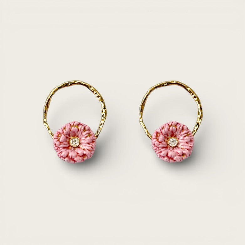 Fable and Mirth pink thistle flower loop earrings with gold plated twisted detail and a small crystal accent.