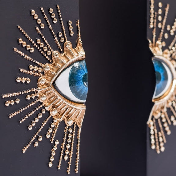Pair of Embossed "Sunburst Eye" Bookends