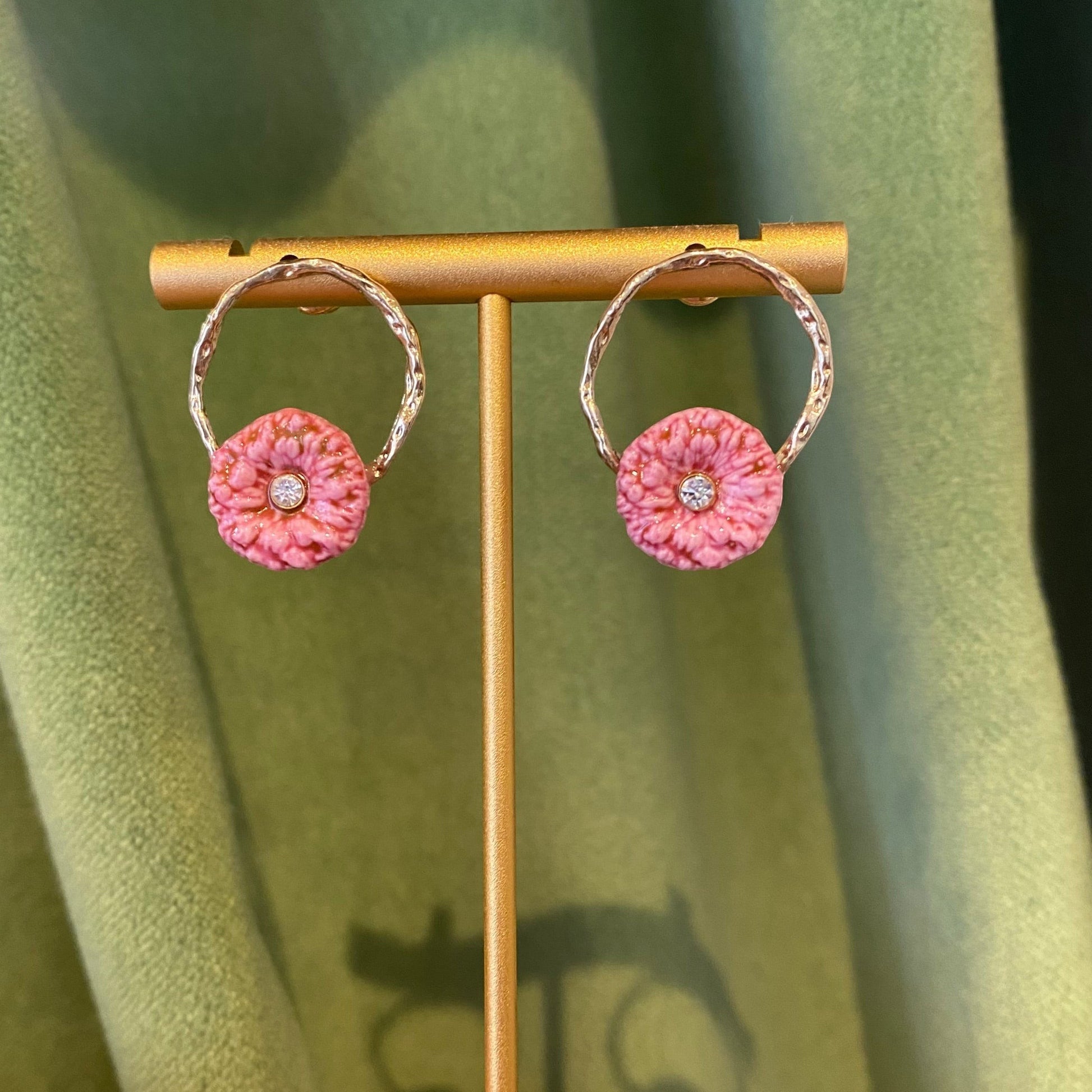 Fable and Mirth pink thistle flower loop earrings with gold plated twisted hoops and a crystal accent.
