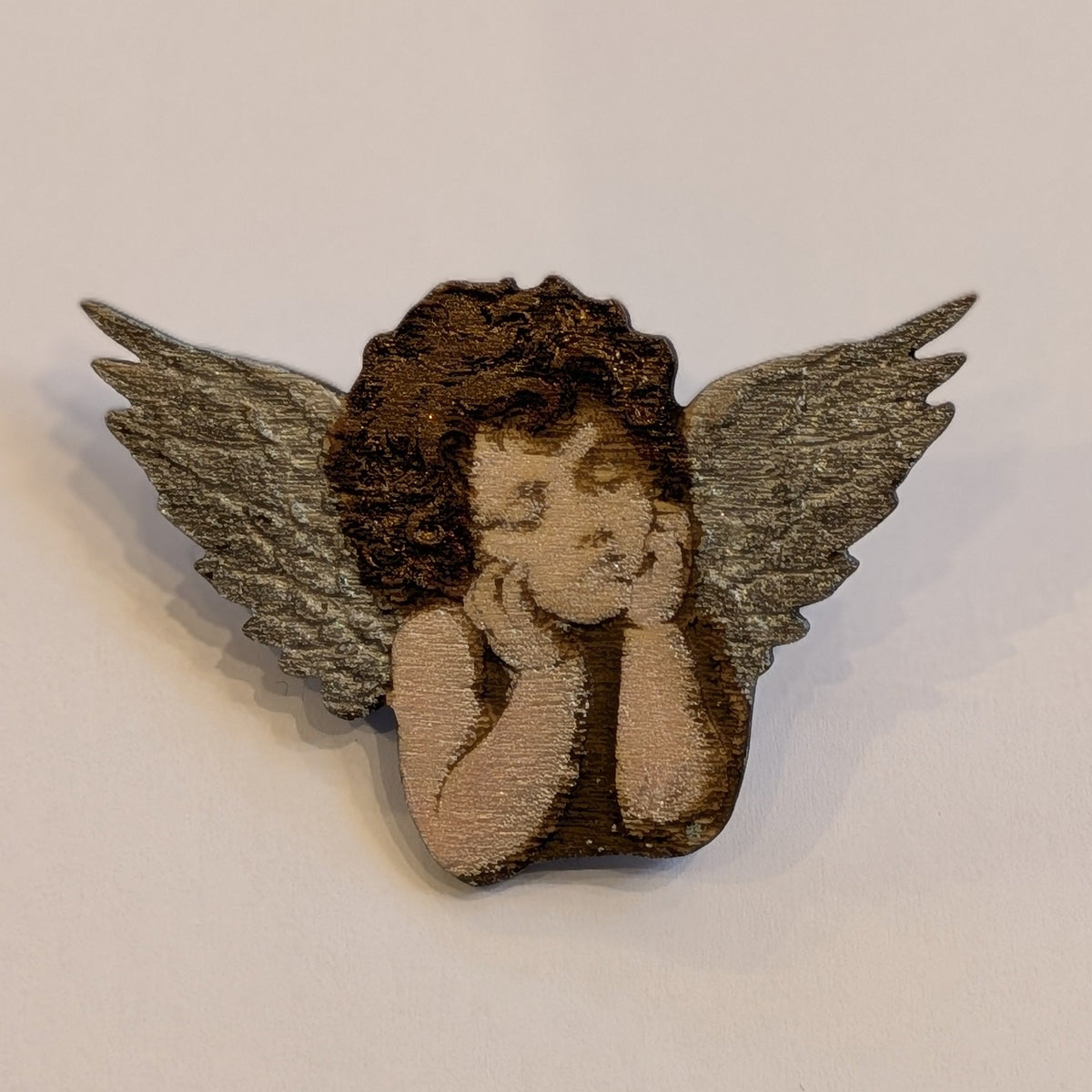 Shimmering Metallics, Engraved Wood Cherub Brooch