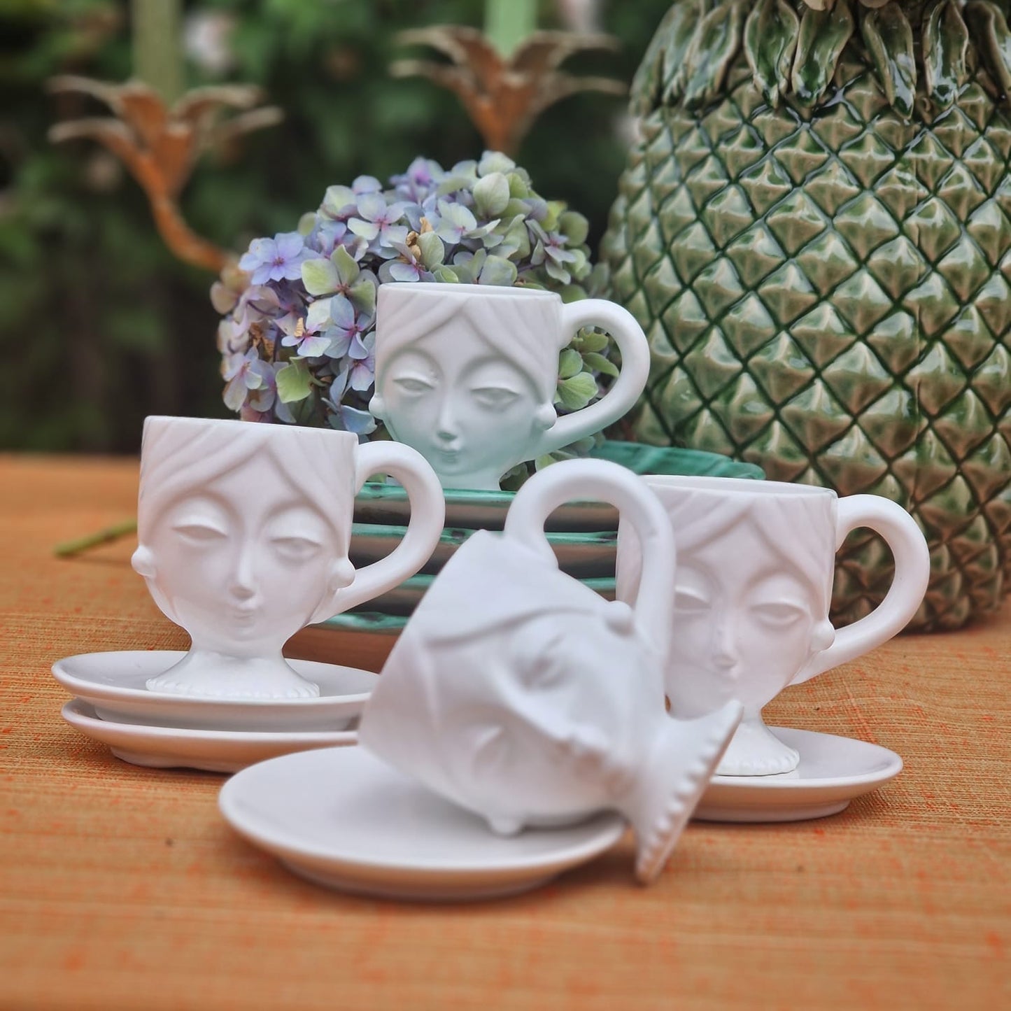 Set of Four Porcelain Face Espresso Cups