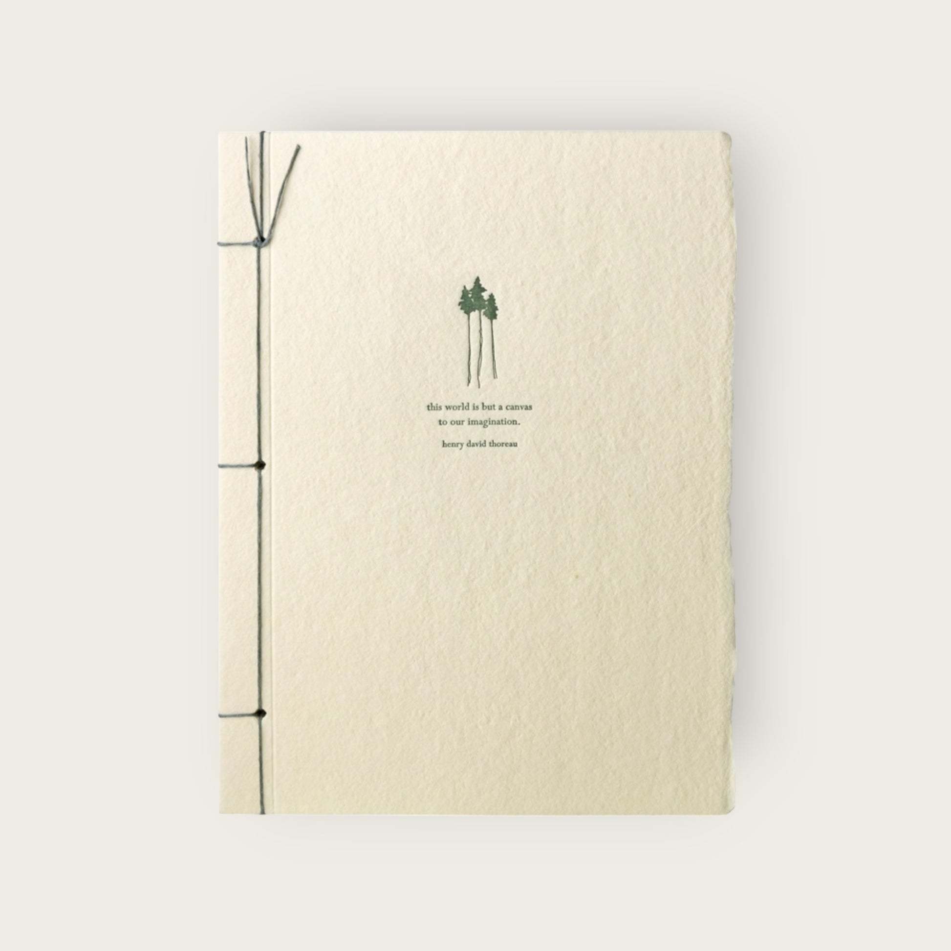Beige notebook with green design and text on a white background