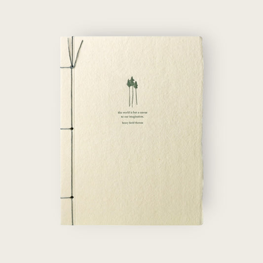 Beige notebook with green design and text on a white background