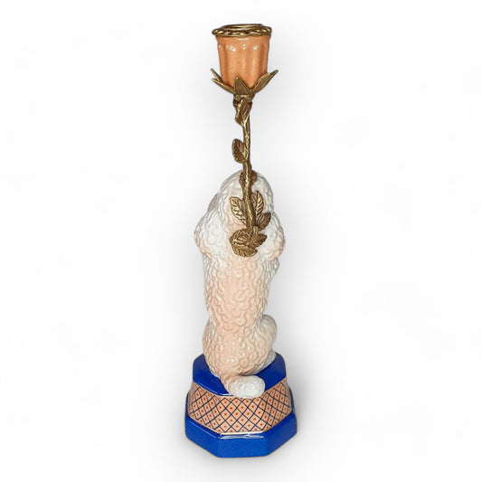 Decorative candle holder with a poodle design on a white background