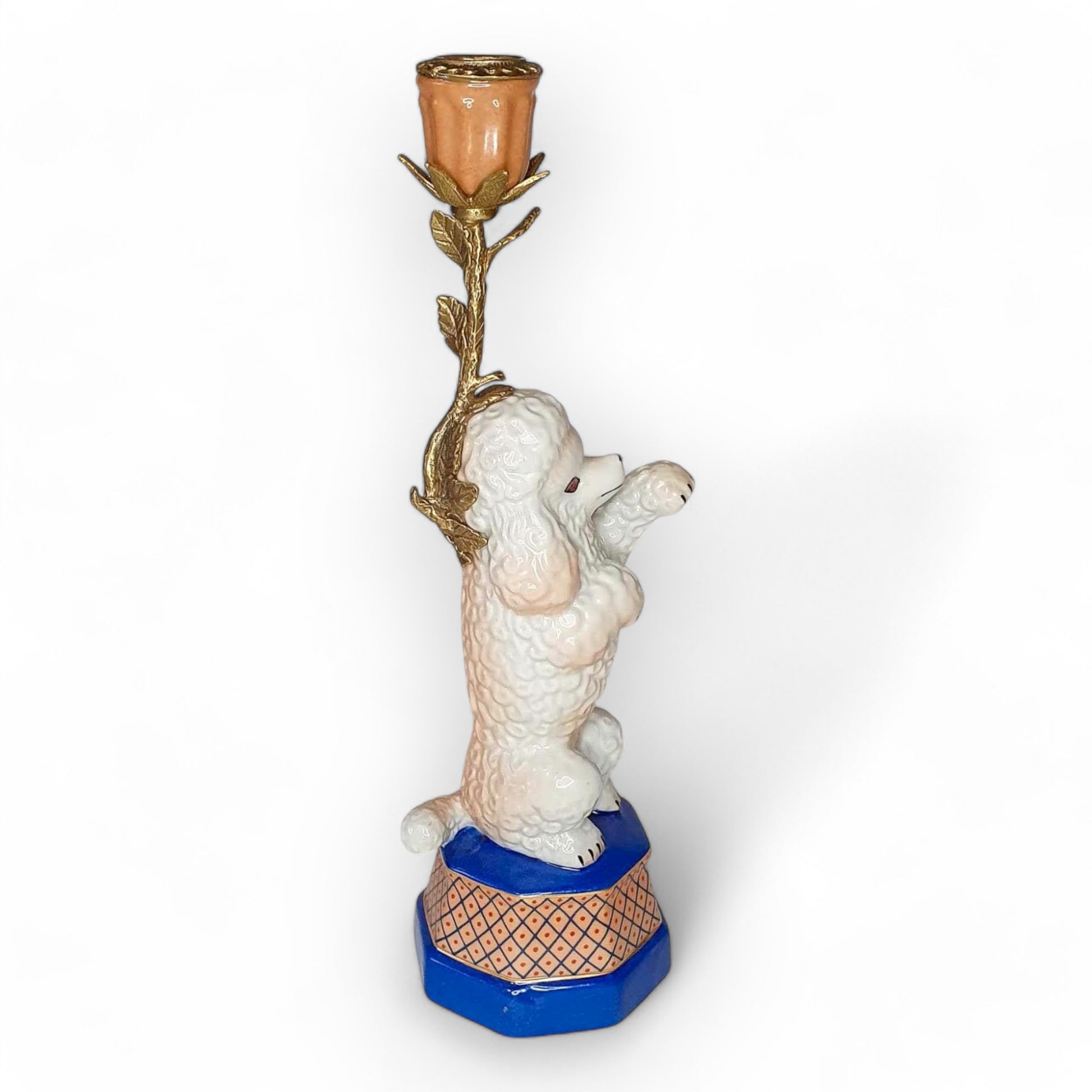 Decorative candle holder with a dog design on a white background