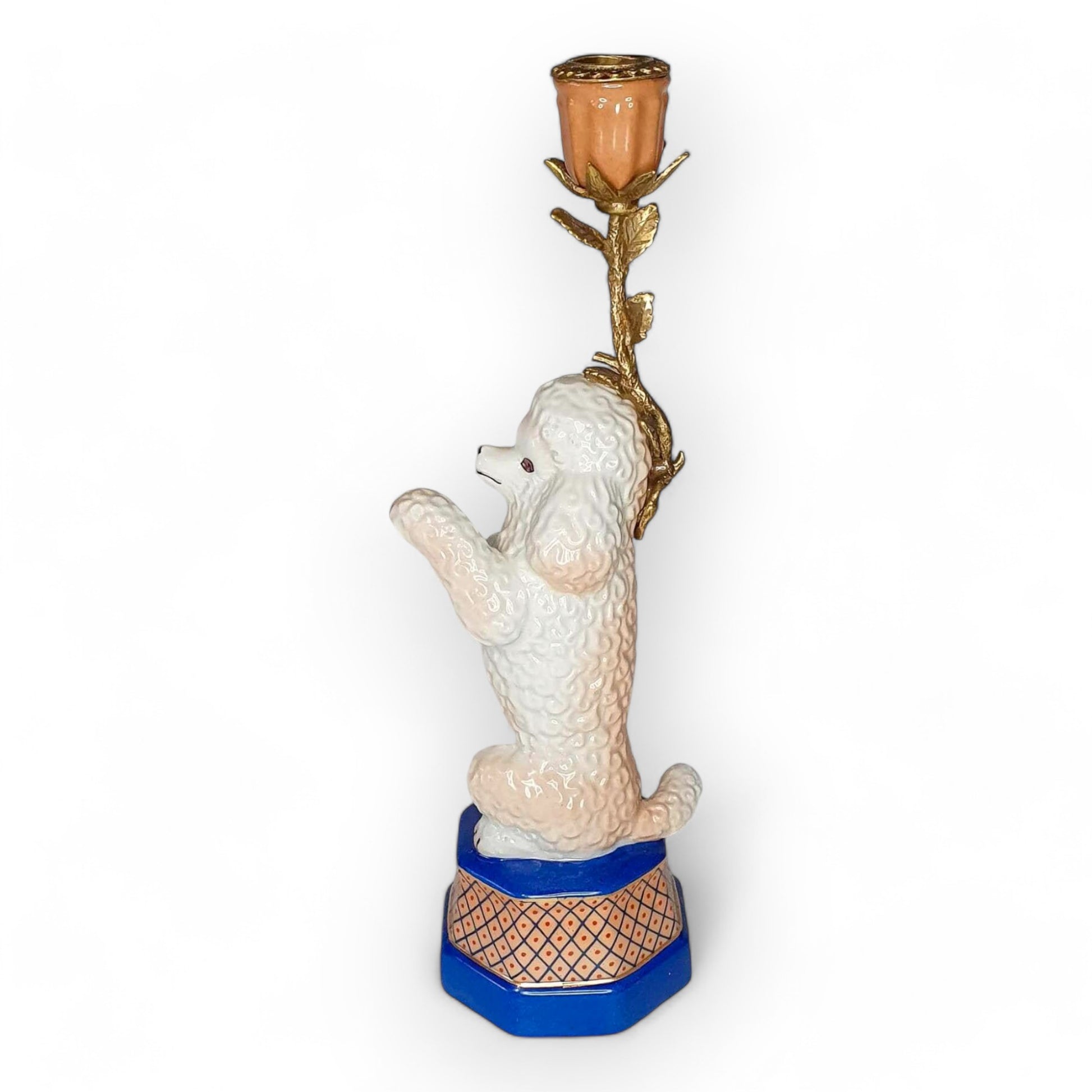 Decorative poodle figurine with a candle holder on a white background
