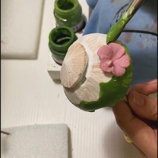 the stapler being painted by hand