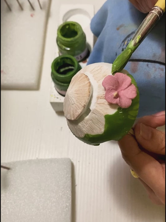 the stapler being painted by hand